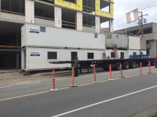 Moving containers that acted as walk-through sidewalks during some heavy-duty construction.